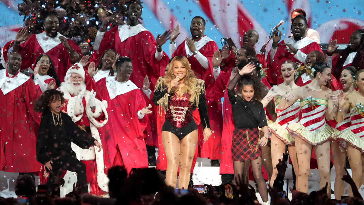In this image released on December 19, Mariah Carey (C) performs onstage with Moroccan Cannon (L) and Monroe Cannon (R) during her "Merry Christmas To All!" at Madison Square Garden on December 13, 2022 in New York City.