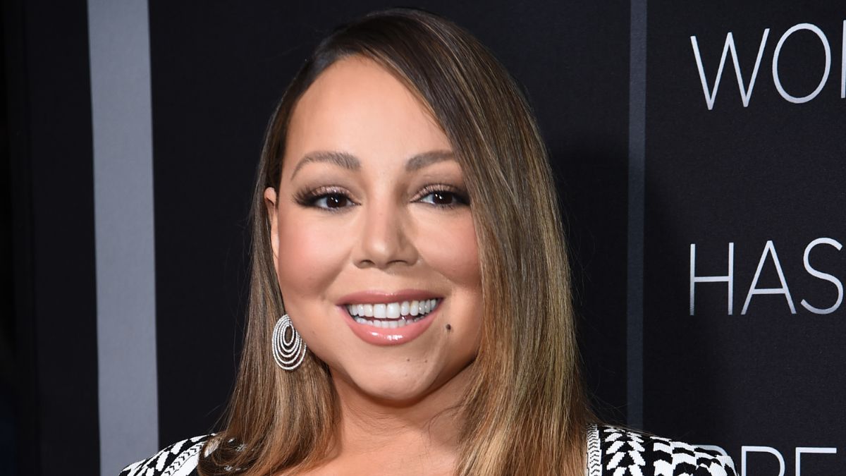 Mariah Carey smiles on the red carpet