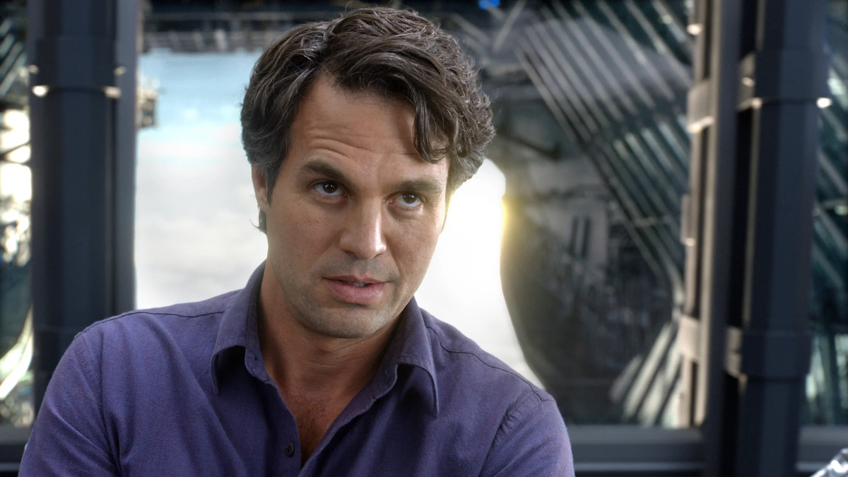 Mark Ruffalo as Bruce Banner with a purple shirt on board the SHIELD helicopter in The Avengers. 