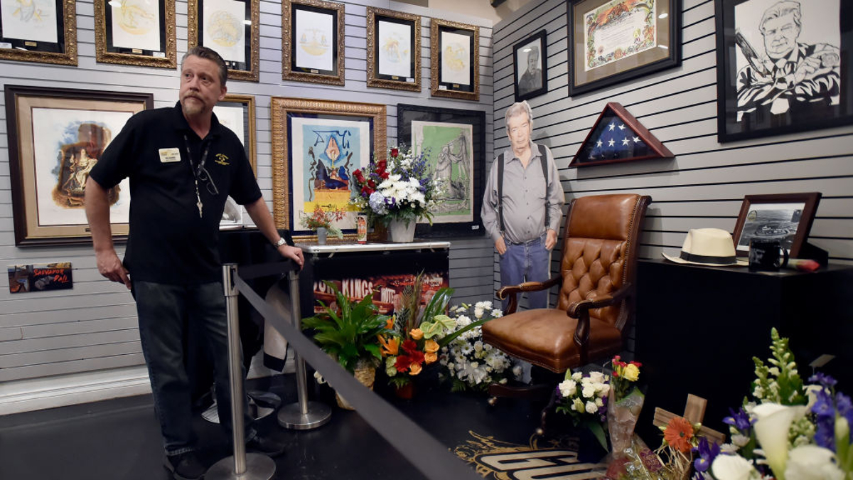 Gold & Silver Pawn Shop salesman Richard Tucker adjusts barrier stanchions at a memorial for Richard "The Old Man" Harrison from History's "Pawn Stars" television series at the Gold & Silver Pawn Shop on June 26, 2018 in Las Vegas, Nevada. Harrison died on June 25, 2018, at the age of 77 after a battle with Parkinson's disease. 