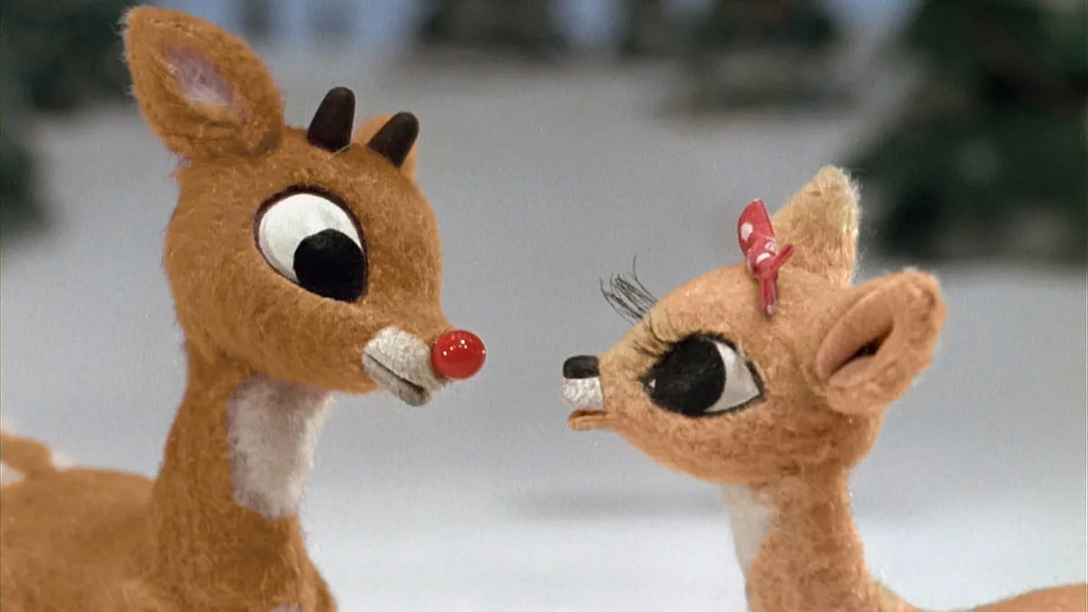 Rudolph talks to a femal reindeer.