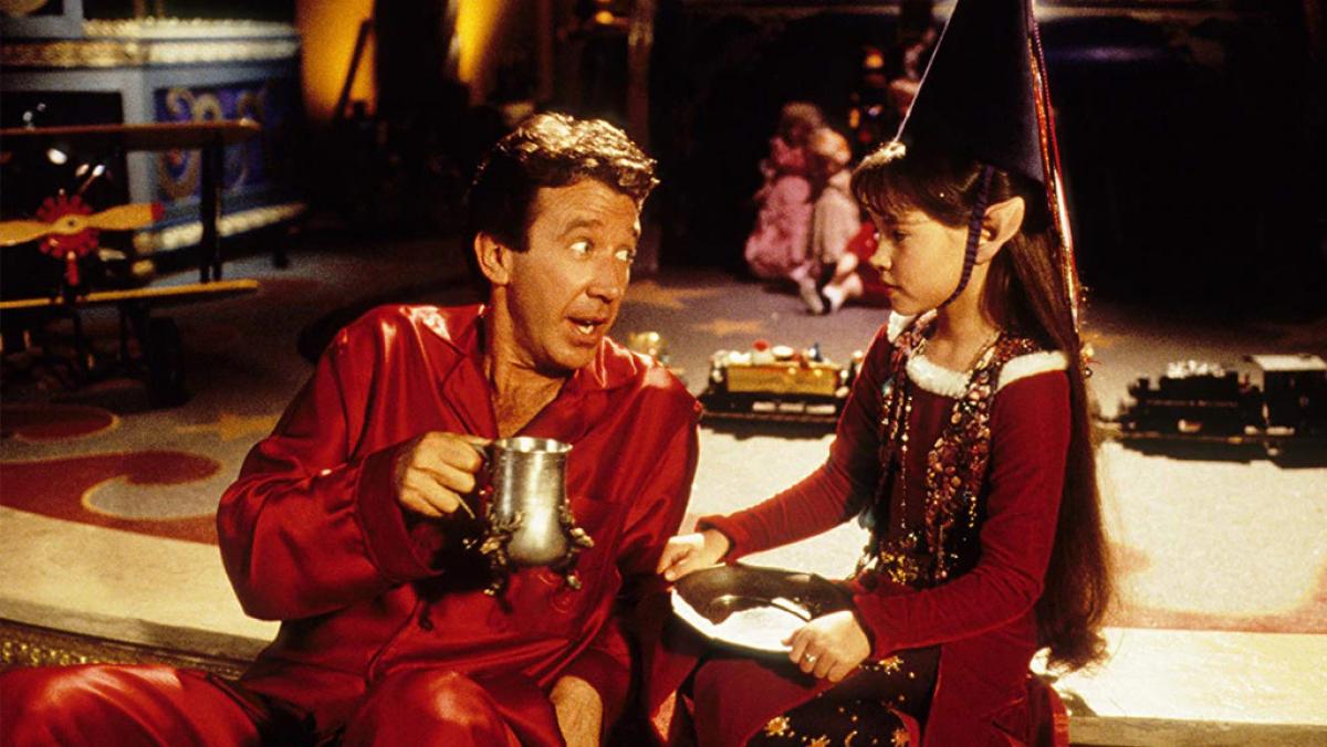 Scott Calvin and Judy the Elf drinking cocoa.