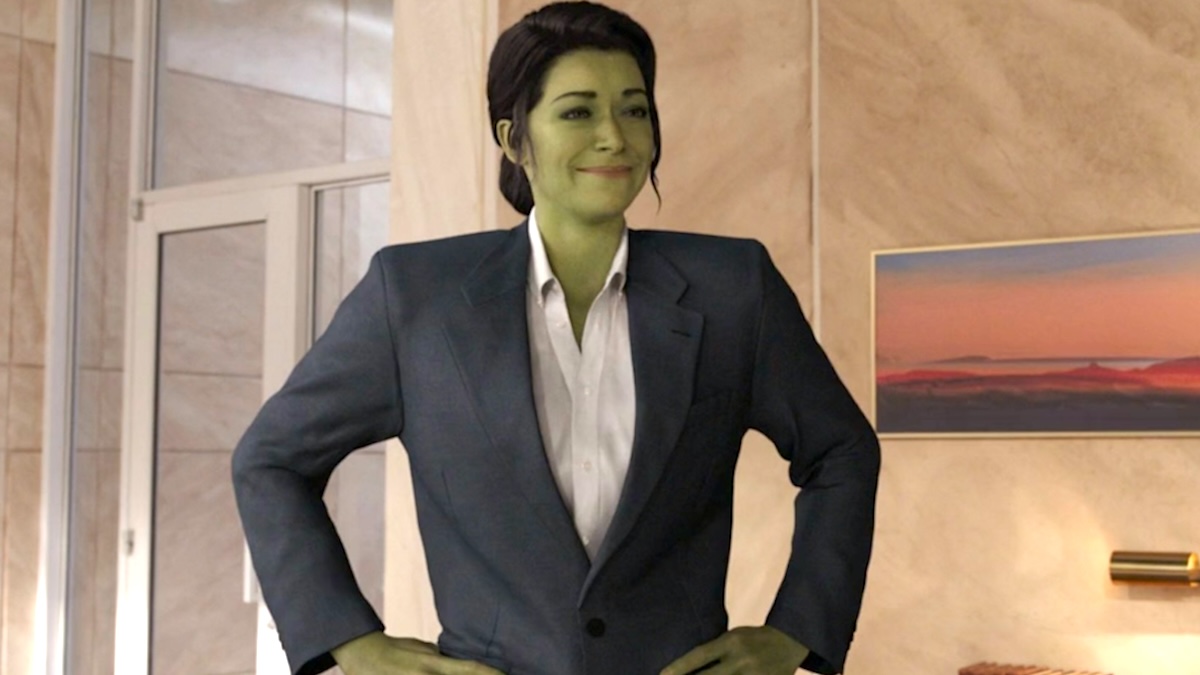 Tatiana Maslany as Jennifer Walters in She-Hulk form wearing an oversized suit in 'She-Hulk: Attorney At Law'