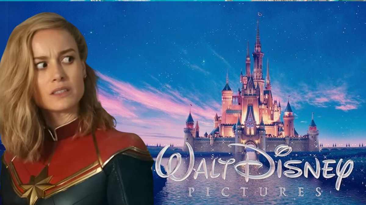 Captain Marvel looking over her shoulder superimposed over an image of The Walt Disney Pictures logo