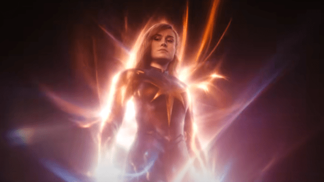 A glowing Captain Marvel floats in space in The Marvels.