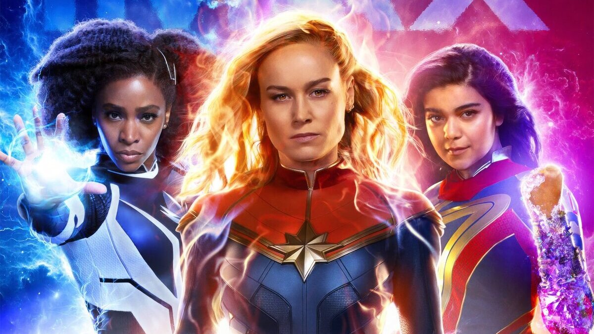 The cropped IMAX poster for The Marvels, featuring Monica Rambeau [L], Captain Marvel [C]. and Ms. Marvel [R].