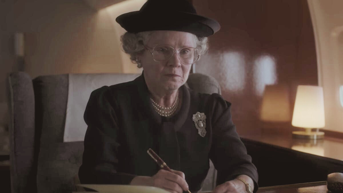 Queen Elizabeth holding pen