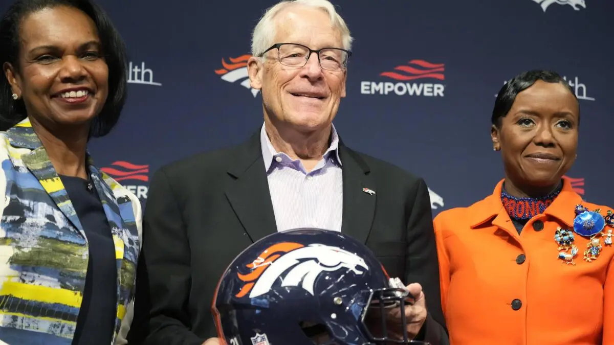 Denver Broncos current ownership, which includes Walmart heir Rob Walton (c), and former US Secretary of State Condoleeza Rice (l).