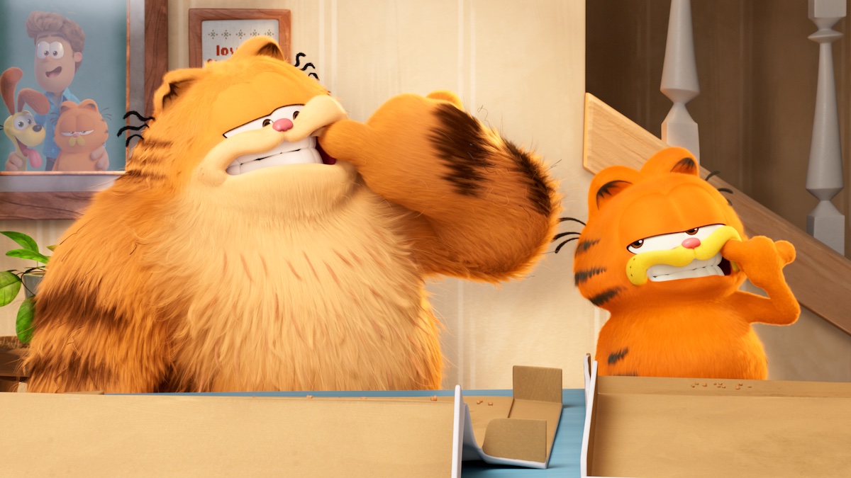 Garfield and Vic picking food out of their teeth in 2024's 'The Garfield Movie'