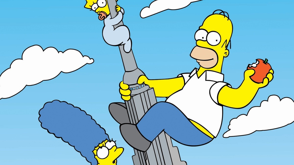 Homer, Marge, and Maggie are holding on to the Empire State Building. 