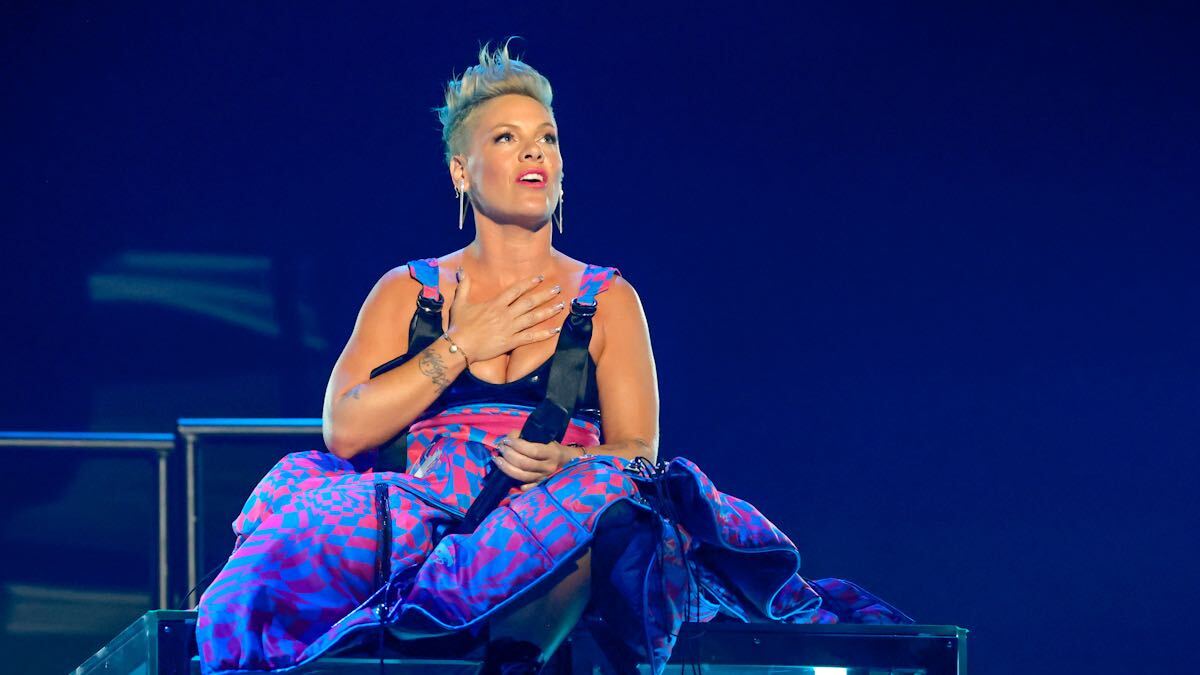 Pink sitting on stage at the 2023 iHeartRadio Music Awards