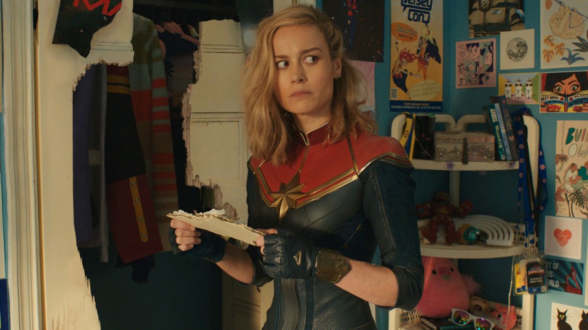 Captain Marvel staring off into space and very confused as to how she ended up in Kamala Khan's bedroom.