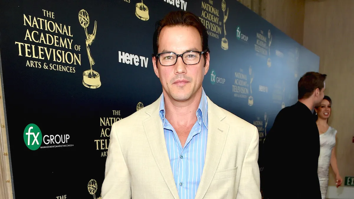 Tyler Christopher wearing a beige suit and black glasses at the 41st Annual Daytime Emmy Awards in 2014.