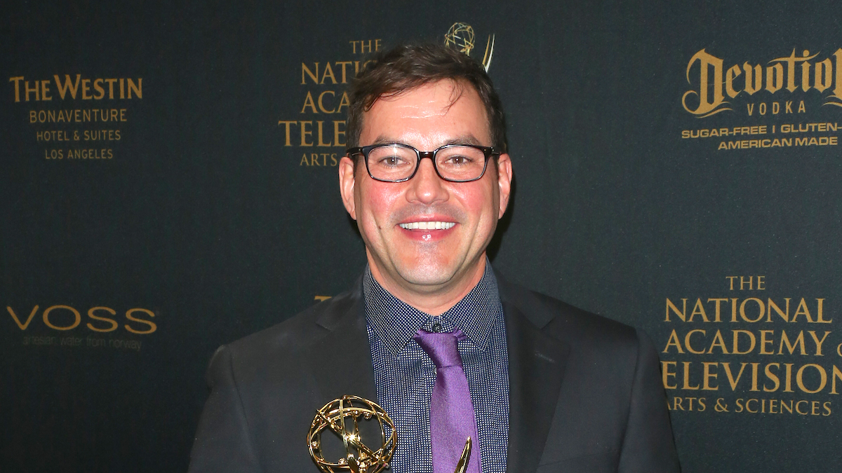 Tyler Christopher wearing black glasses, a black suit, and a purple tie at the 2016 Daytime Emmy Awards