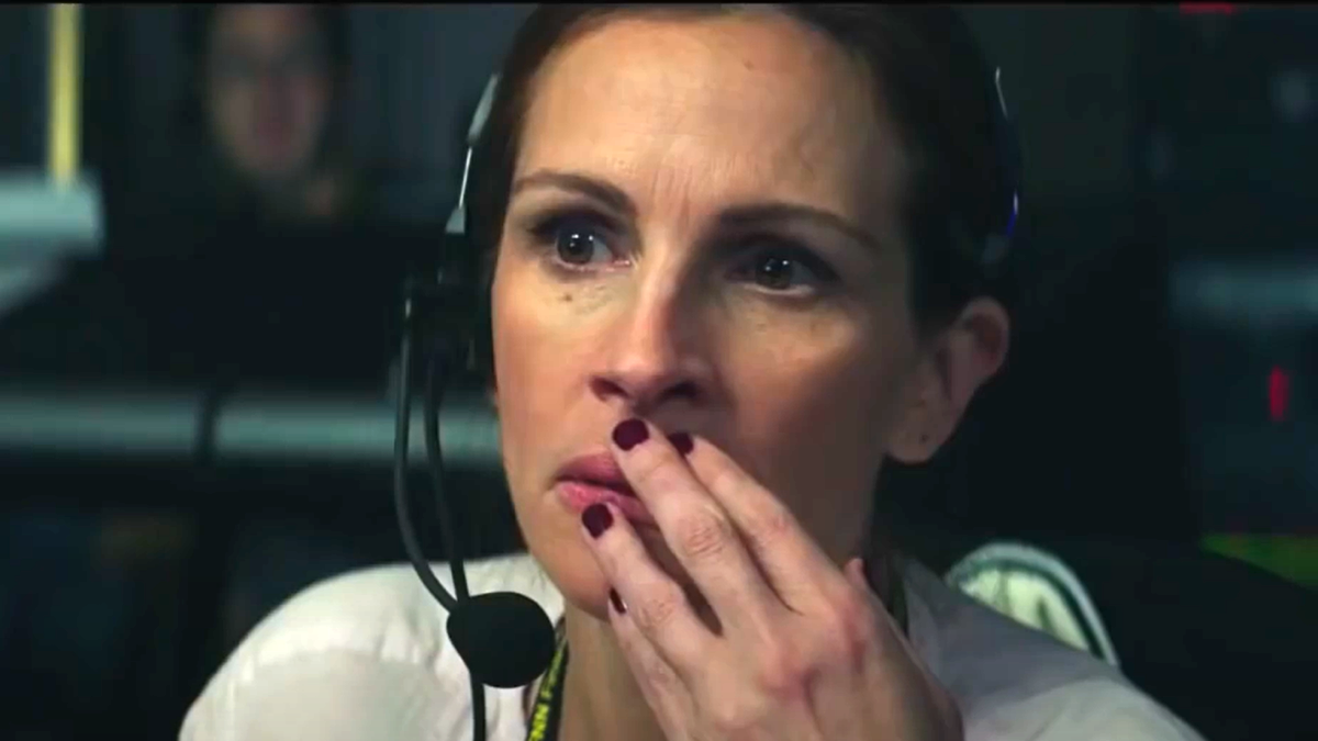 Julia Roberts in 'Money Monster," wearing a headset and looking concerned.