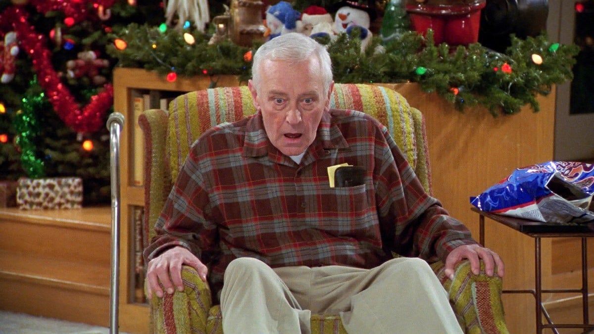 A high Martin Crane stares at the TV screen in Frasier: High Holiday
