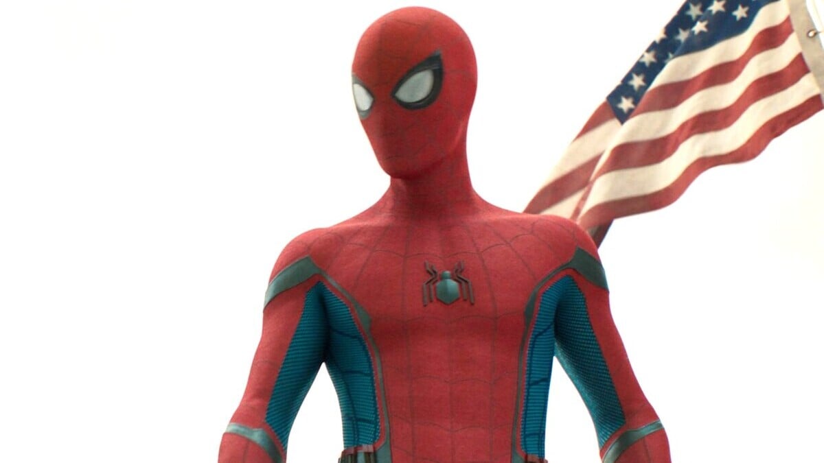 Spider-Man stands in front of the American flag in Spider-Man: Homecoming