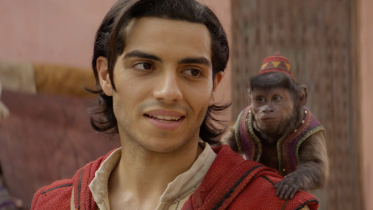 Aladdin with Abu on his shoulder in the live-action Aladdin remake.