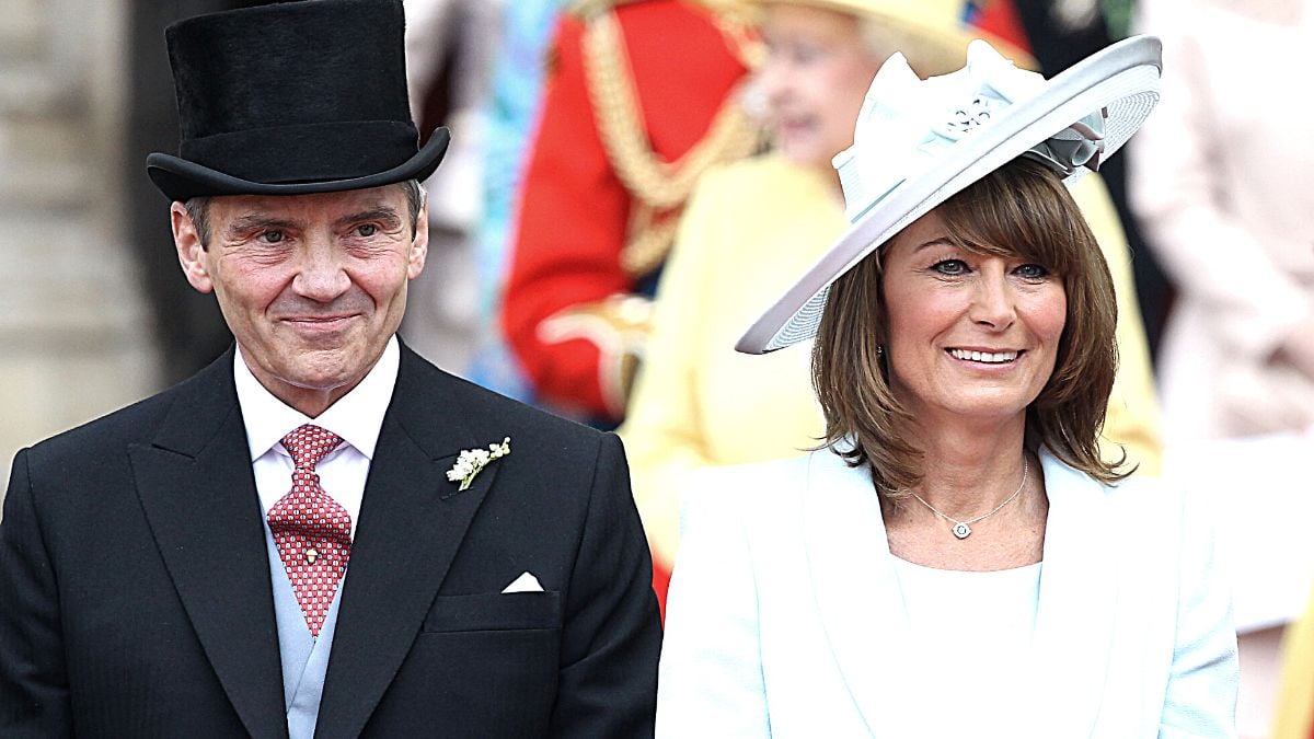 LONDON, ENGLAND - APRIL 29: Michael and Carole Middleton smile at the crowds following the marriage of Prince William, Duke of Cambridge and Catherine, Duchess of Cambridge at Westminster Abbey on April 29, 2011 in London, England.