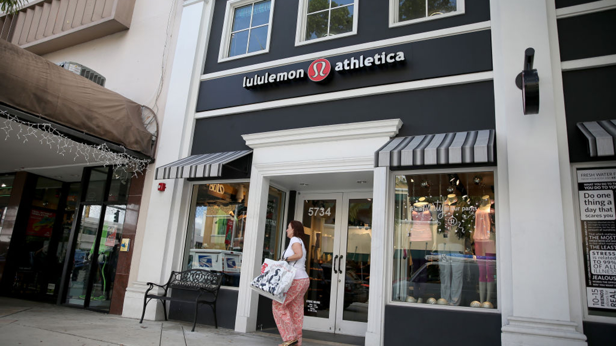 A woman walks past a Lululemon Athletica store on December 10, 2013 in Miami, Florida. Lululemon Athletica, Inc. named Laurent Potdevin as their new chief executive and said founder Chip Wilson will step down as chairman after Wilson recently issued a formal apology for remarks he made about how "some women's bodies just don't actually work" for his company's yoga pants. 