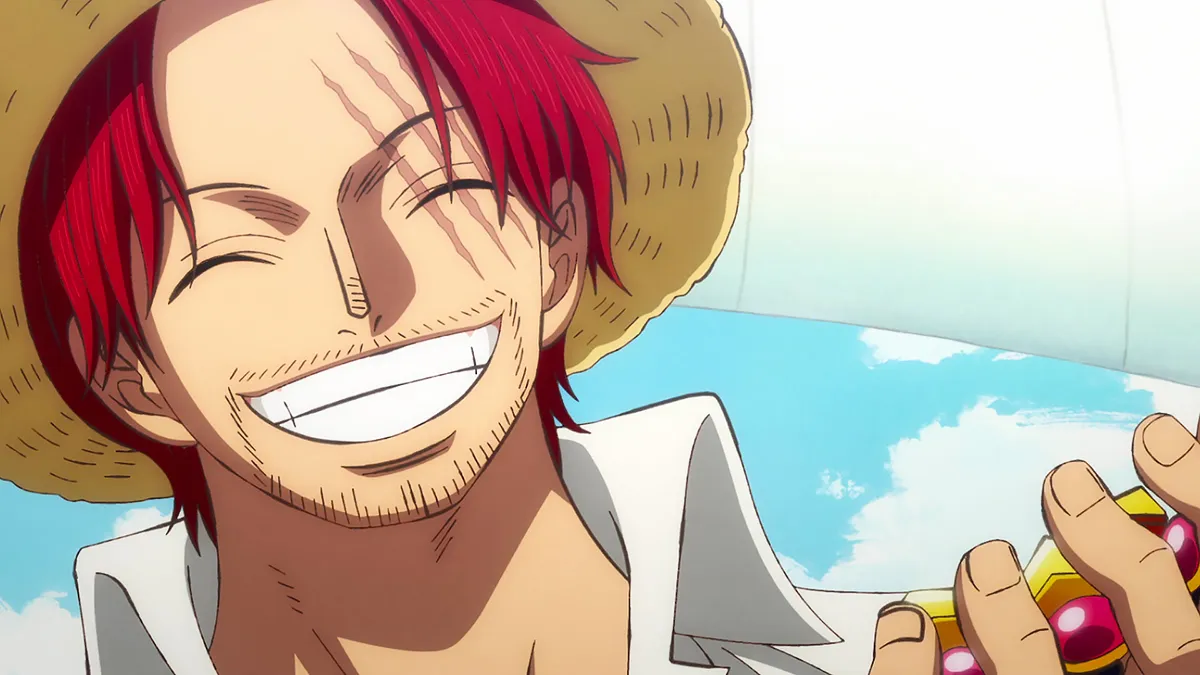 Shanks smiling while wearing the Straw Hat in One Piece