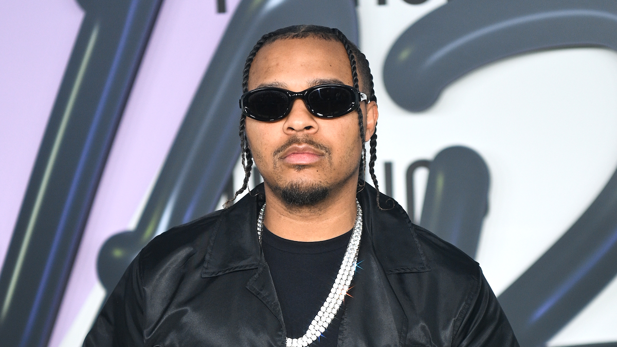 Bow Wow wearing black sunglasses, a black shirt, a black jacket, and a pearl necklace at the 2023 BET Hip Hop Awards