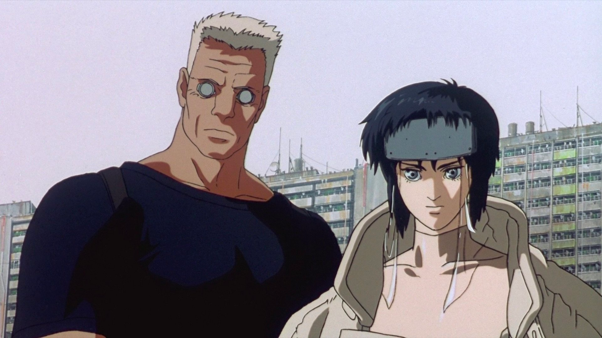 Two characters from Ghost in the Shell are looking down at something.