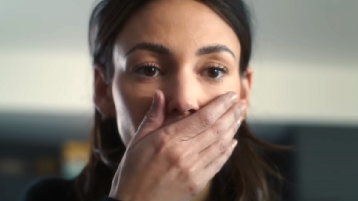 Maya Stern (Michelle Keegan) holds her hand over her mouth in 'Fool Me Once.'