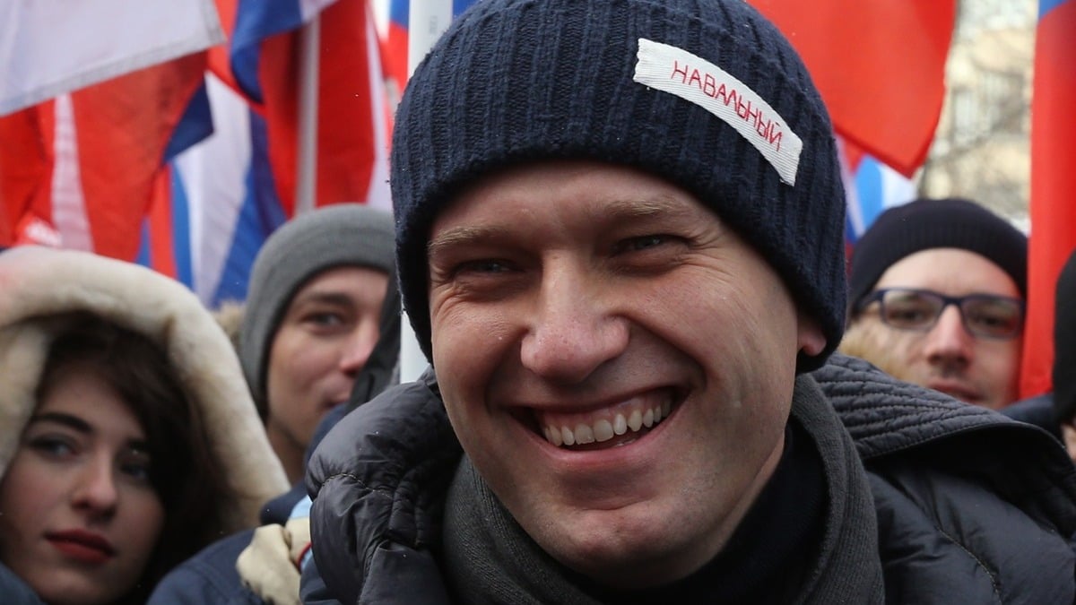 Russian opposition leader Alexei Navalny smiles during the Nemtsov March, a rally in memory of Boris Nemstov, former First Deputy Prime Minister, writer and opposition activist, killed 3 years ago at the bridge near the Kremlin, in Moscow, Russia, February 25, 2018. Russian opposition held rallies in Moscow and many other towns, gathered thousands suporters, prior to the Presidential Elections 2018 planned on March,18.