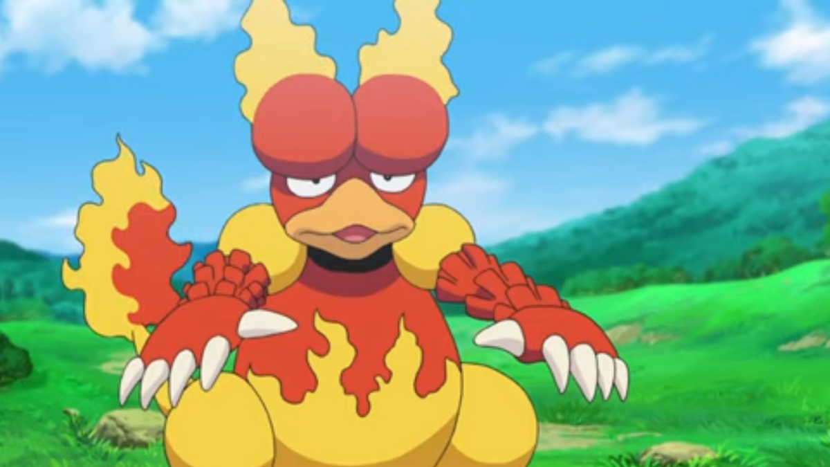 Magmar standing in a grassy field.