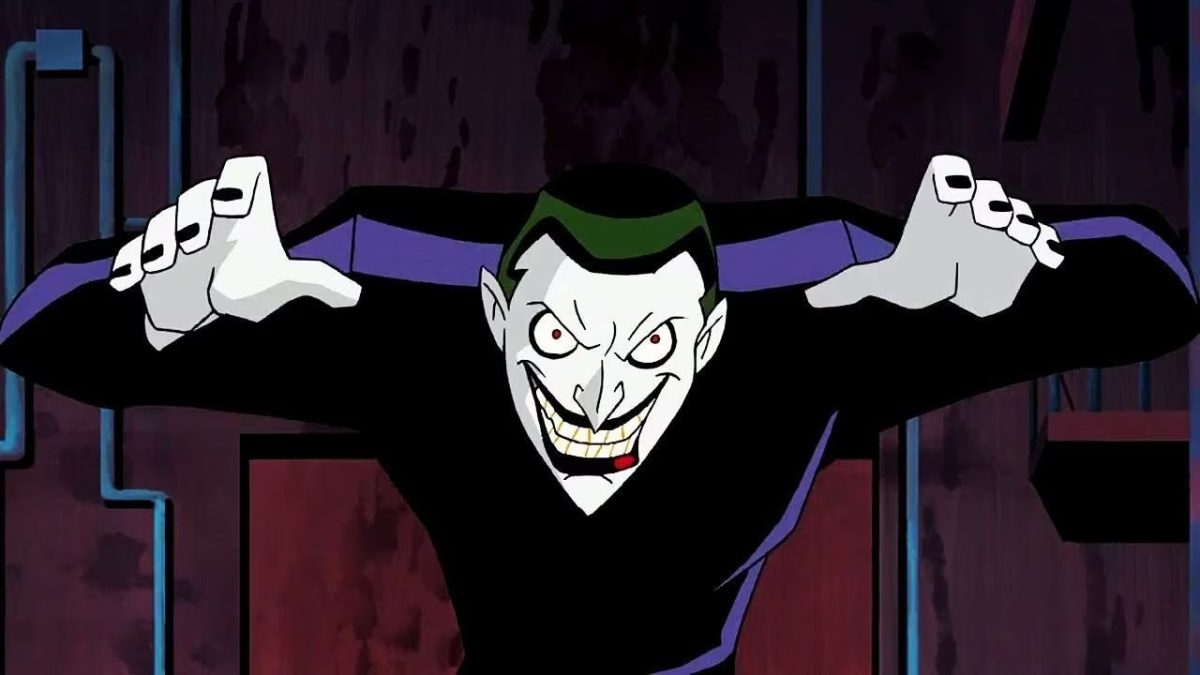 The Joker (Tim Drake) grins malevolently and raises his arms in Batman Beyond: Return of the Joker