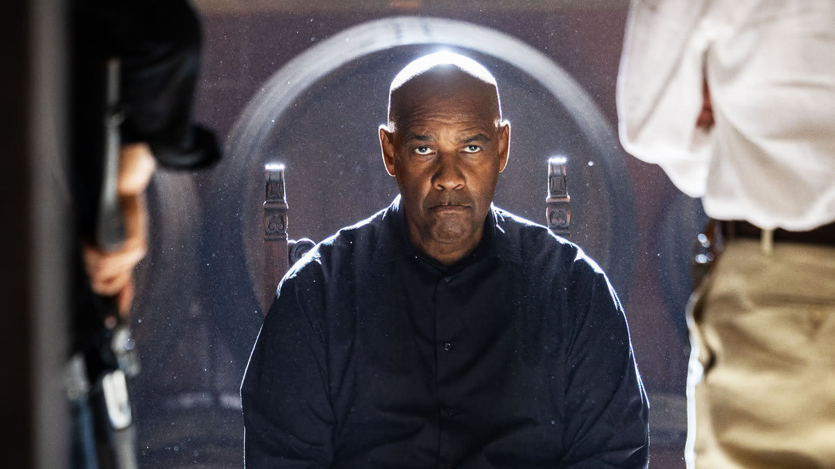 Denzel Washington is sitting in a chair and looking straight ahead in The Equalizer 3.