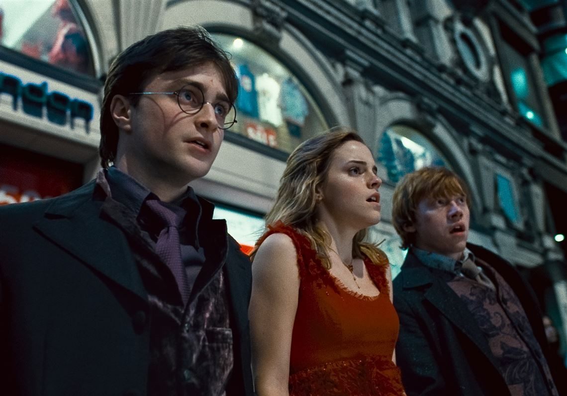 Harry Potter is standing with Hermoine and Ron in Deathly Hallows.