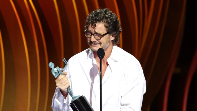 Pedro Pascal wearing glasses and a white button-down as he accepts an award at the 2024 SAG Awards