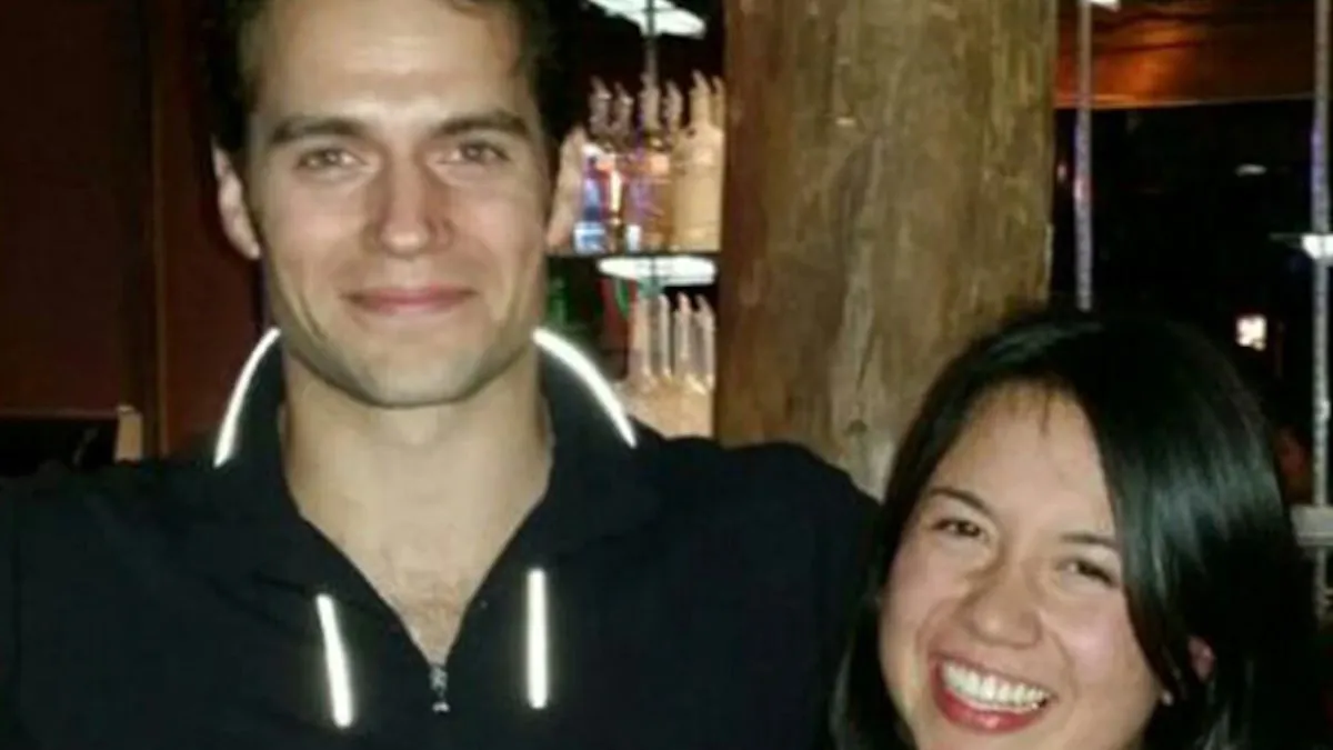 Henry Cavill and Marisa Gonzalo are smiling next to each other.