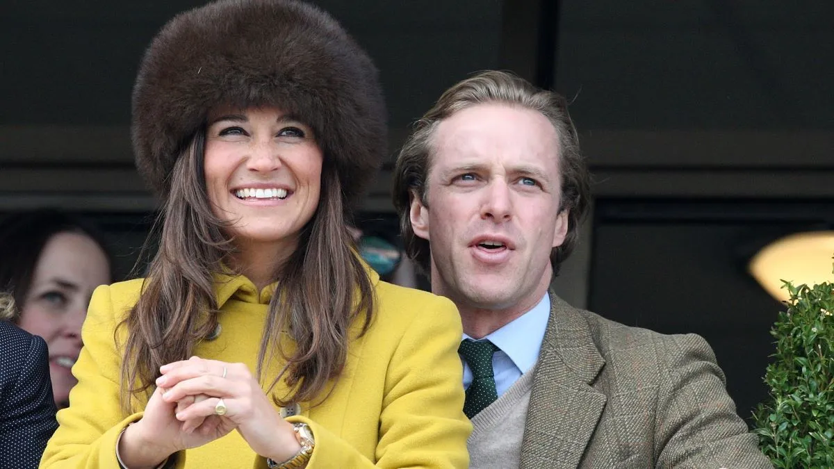 Pippa Middleton and friend Tom Kingston watch the Queens Mother Champion Steeple Chase on day 3 of the Cheltenham Festival at Cheltenham Racecourse on March 14, 2013 in Cheltenham, England. (Photo by Danny Martindale/Getty Images)