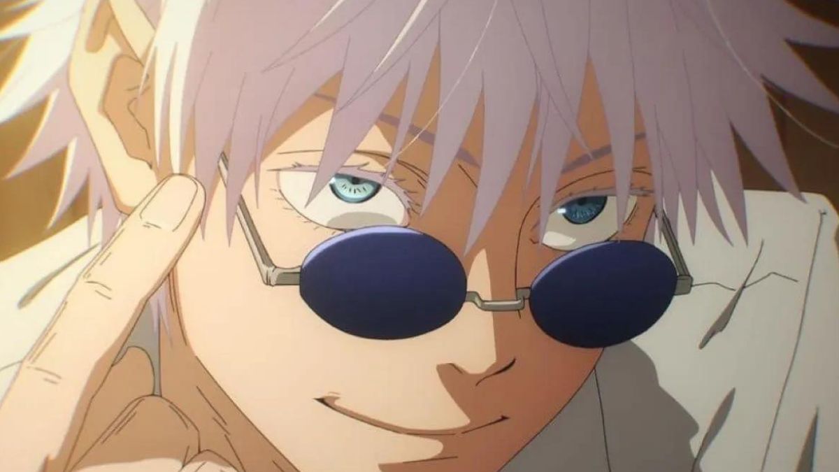 Gojo smiles at the screen with black sunglass on the eyes