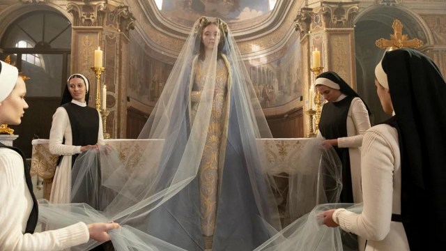 Sydney Sweeney is surrounded by nuns that dress her as a saint in the horror movie Immaculate