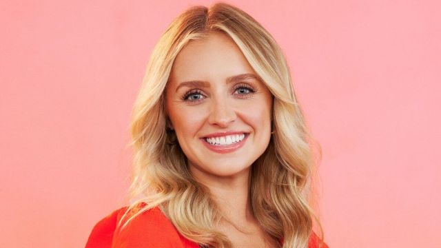 Daisy Kent smiling in a promotional image for 'The Bachelor' season 28.