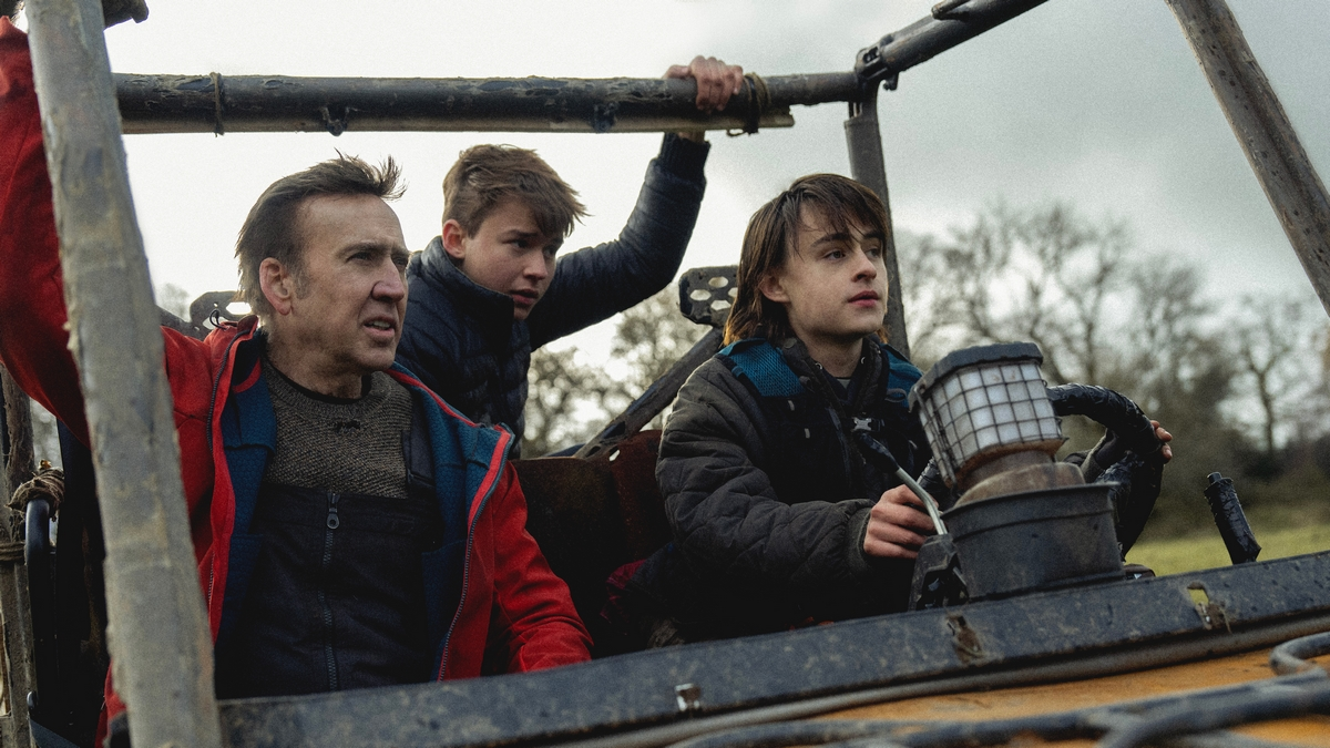 Nicolas Cage, Maxwell Jenkins, and Jaeden Martell in a makeshift car in the horror movie Arcadian