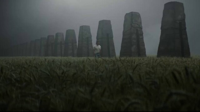 Hugh Jackman next to mysterious stone structures in Deadpool & Wolverine