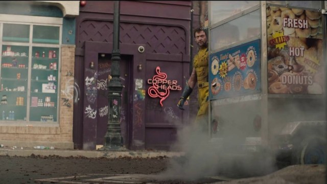 Hugh Jackman walking on destroyed street in Deadpool & Wolverine