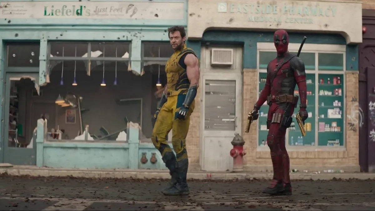Hugh Jackman and Ryan Reynolds walking on destroyed street in Deadpool & Wolverine