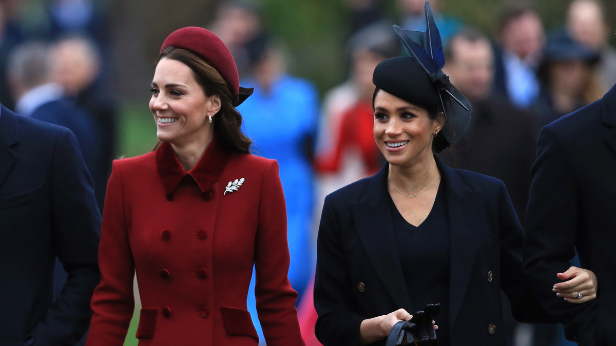 Catherine, Duchess of Cambridge and Meghan, Duchess of Sussex arrive to attend Christmas Day Church service at Church of St Mary Magdalene on the Sandringham estate on December 25, 2018 in King's Lynn, England. 