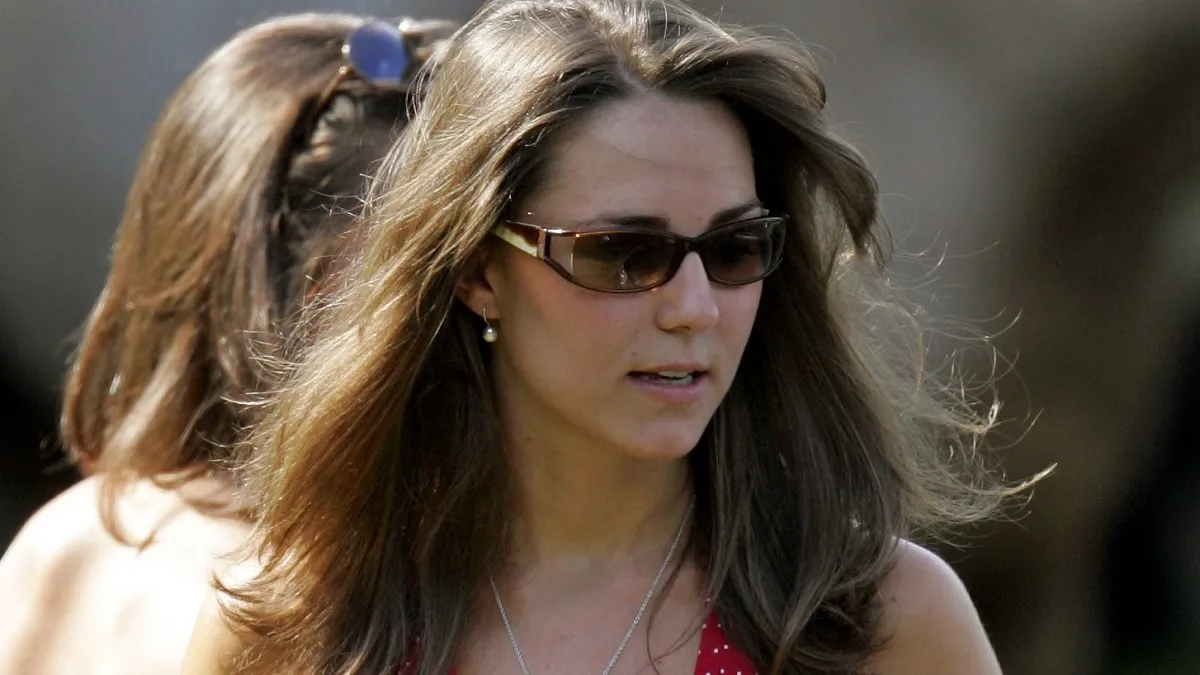 Kate Middleton carries a Police radio as she watches Prince William compete in the Chakravarty Cup charity polo match at Ham Polo Club on June 17, 2006 in Richmond, England. (Photo by Indigo/Getty Images)