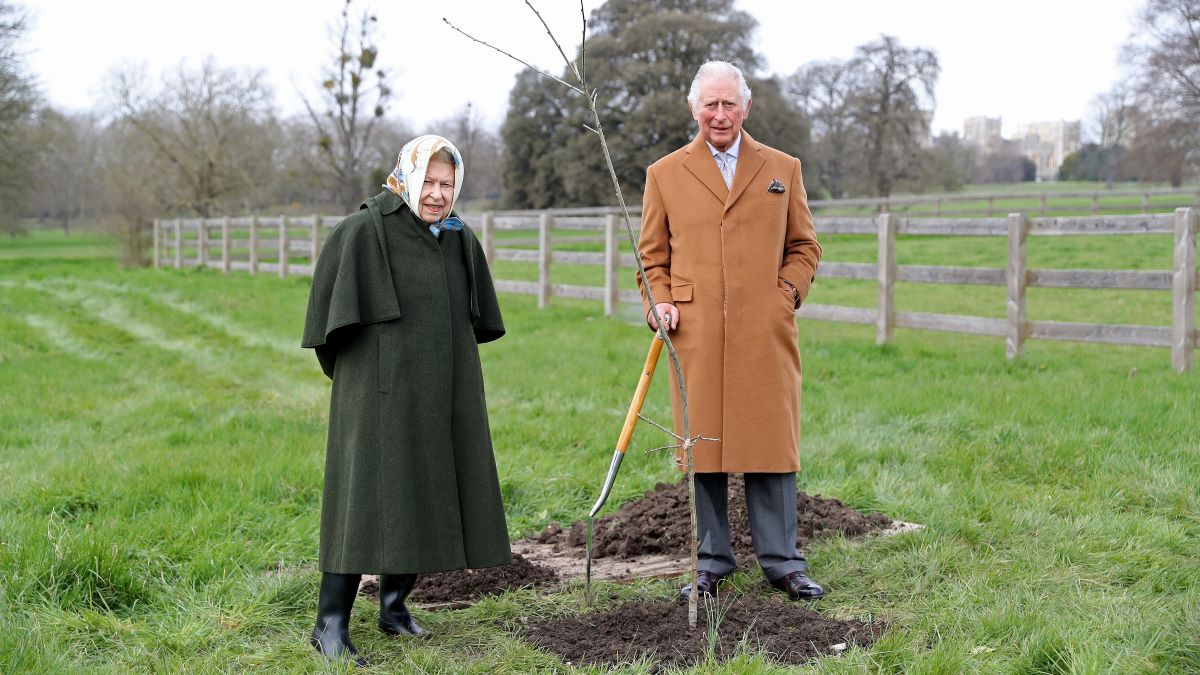 , Queen Elizabeth II and The Prince of Wales pose with the first Jubilee tree in the grounds of Windsor Castle earlier this year, on March 23, 2021 in Windsor, England. The tree was planted by The Prince of Wales to launch The Queen’s Green Canopy (QGC), a unique, UK-wide tree planting initiative created to mark Her Majesty’s Platinum Jubilee in 2022, of which His Royal Highness is Patron. (Photo by Chris Jackson/Getty Images)
