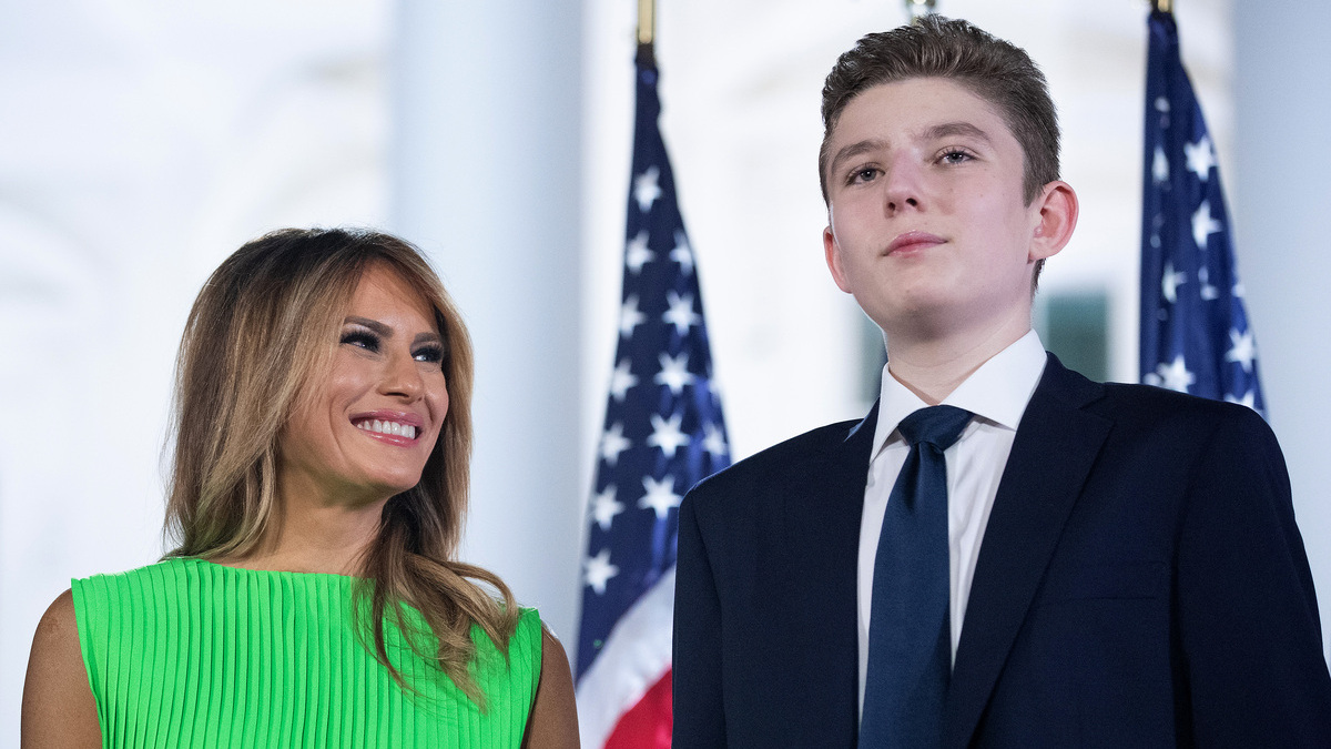 First lady Melania Trump (L) looks at her son Barron Trump after U.S. President Donald Trump delivered his acceptance speech for the Republican presidential nomination on the South Lawn of the White House August 27, 2020 in Washington, DC. Trump gave the speech in front of 1500 invited guests.