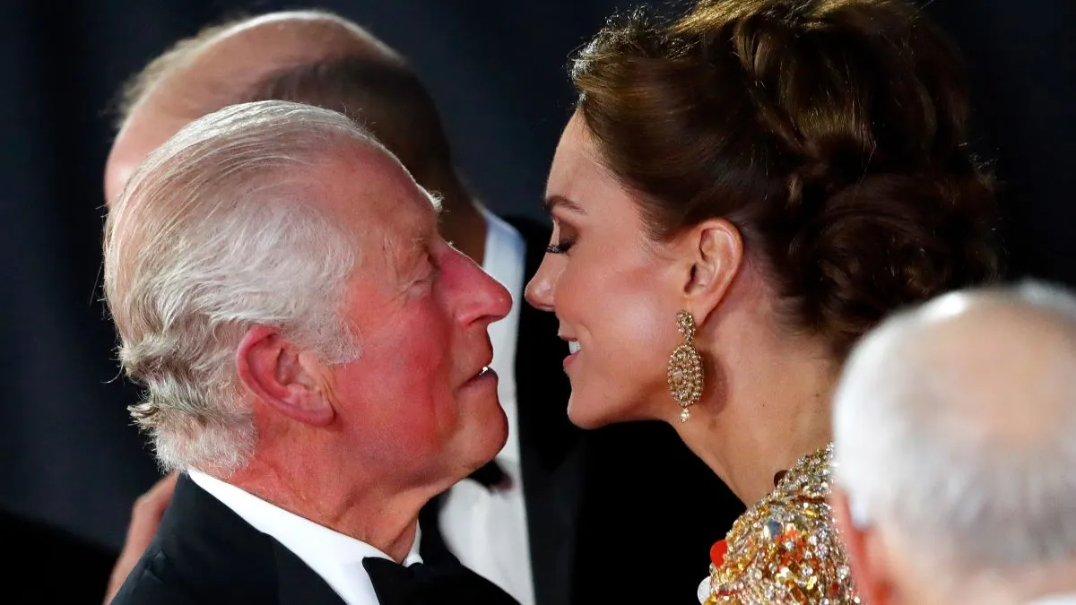 Prince Charles, Prince of Wales kisses Catherine, Duchess of Cambridge as they arrive to attend the "No Time To Die" World Premiere at the Royal Albert Hall on September 28, 2021 in London, England. (Photo by Max Mumby/Indigo/Getty Images)