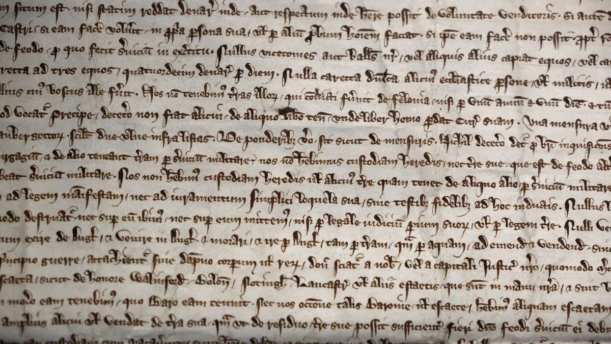 A close-up photograph of The City of London Corporation’s 1297 copy of Magna Carta on display at its Heritage Gallery within Guildhall Art Gallery on September 20, 2022 in London, England. "One of the finest surviving 13th-century copies of this historic document, it has been on rare public display for the last few months and returns to London Metropolitan Archives on Thursday," according to the museum. (Photo by Chip Somodevilla/Getty Images)