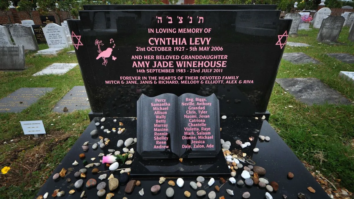 A view of the black marble headstone that marks the final resting place of Singer Amy Winehouse at Edgwarebury Jewish cemetery on June 12, 2013 in London, England. Winehouse died of alcohol poisoning on July 23, 2011. (Photo by Jim Dyson/Getty Images)